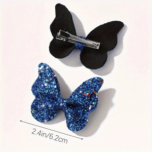 Dettaglio di fermagli per capelli a farfalla blu glitterati da 6,2 cm con clip in metallo