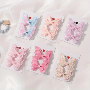 Dettaglio di 6 paia di fermagli per capelli a farfalla glitterati per bambini