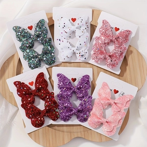 Set di sei fermagli per capelli a farfalla glitterati per bambini su cartoncino