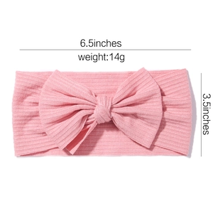 Pink ribbed fabric baby headband with large bow 6.5 inch size and 14g lightweight