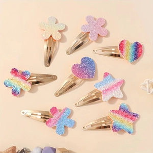 Detail von 8-teiligen Glitzer-Haarspangen-Set mit bunten Stern-, Herz- und Blumenformen
