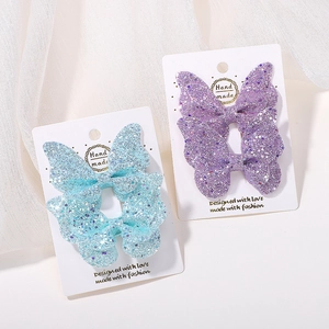 Fermagli per capelli a farfalla glitterati per bambini con paillettes blu e viola