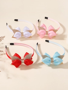 Vue détaillée de quatre serre-têtes à nœuds scintillants colorés pour filles