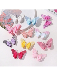 Detail view of colorful sequin butterfly hair clips set with ribbed bows and bead accents