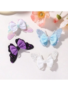 Detail of glitter bow hair clips for kids with bead accents in four pastel colors