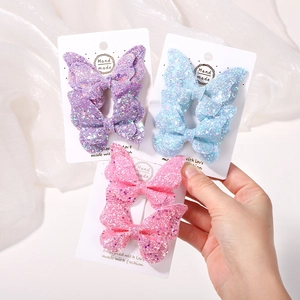 Set di mollette a farfalla glitterate con paillettes per bambine in viola rosa blu