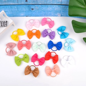 Détail de 18 élastiques à cheveux avec nœuds colorés en ruban pour petites filles
