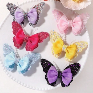 Glitter butterfly hair clips set with six colors in a white ceramic dish for girls