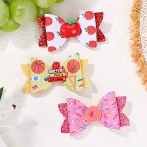 Three-piece set of glitter school bows featuring donuts and stationery patterns