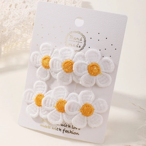 Set of 6 embroidered daisy flower hair clips on display card for toddlers and girls
