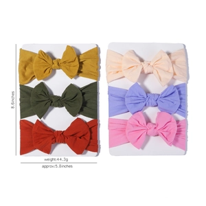 Detail view of 6-piece soft nylon baby headbands with oversized bows and measurements