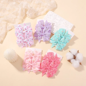 Lot de cinq paires de barrettes nœuds à fleurs et dentelle pour petites filles
