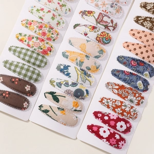 Cute floral and plaid fabric hair clip set for girls featuring various pastoral patterns