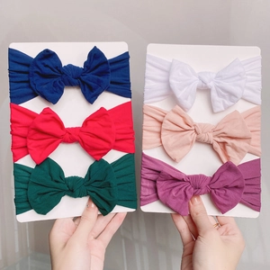 Set of 6 soft elastic nylon baby headbands with large bows in assorted solid colors