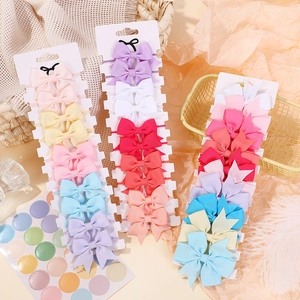 Set di elastici per capelli con fiocchi colorati macaron per bambine su carta display