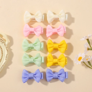 Detailed set of 10 solid color ribbon bow hair clips for kids in five soft candy shades