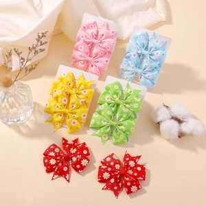 Set de barrettes à nœuds imprimé marguerites pour enfants en rose bleu jaune vert