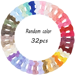 Macro view of 32pcs colorful ribbon bow clips for girls in a circular layout