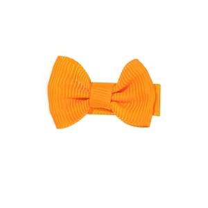 Solid orange grosgrain ribbon bow hair clip for girls with ribbed texture on white background