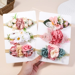 Set of six baby flower headbands with elegant artificial roses and daisy designs