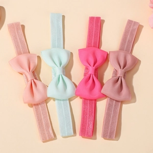 Lot détaillé de quatre bandeaux élastiques pour bébés avec nœuds en gros-grain
