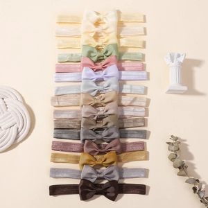 Lot détaillé de 15 bandeaux bébé élastiques colorés avec nœuds en ruban gros-grain