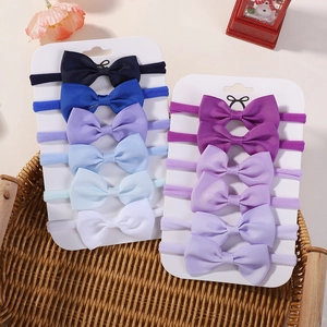 Detail view of 11-piece elastic nylon baby headbands with colorful ribbed fabric bows