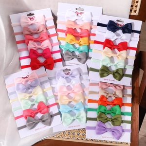 Set of colorful ribbed bow elastic nylon headbands for babies and toddlers in various shades
