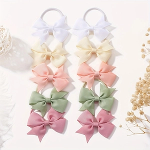 Close-up of 10-piece grosgrain ribbon bow hair ties in five assorted pastel colors