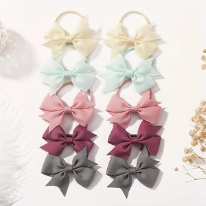 Detailed view of handmade bow hair ties set with ribbed grosgrain ribbon texture
