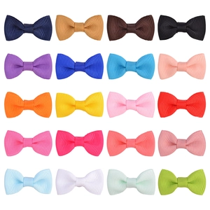 Detailed grid layout showing twenty colors of ribbed grosgrain ribbon hair bows for babies