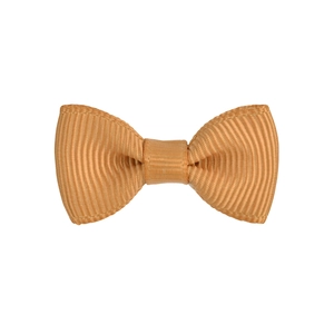 Detailed close-up of caramel ribbed grosgrain fabric texture on a handmade bow