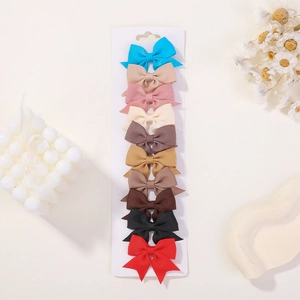 Set of 10 colorful grosgrain ribbon bow hair clips on white display card for girls