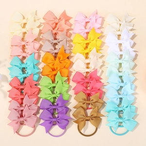 Flat lay set of colorful candy-colored grosgrain ribbon bow hair ties for little girls