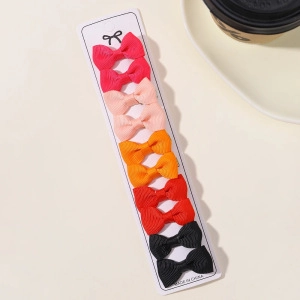 Colorful 10-piece grosgrain ribbon bow hair clip set for kids and babies on a display card