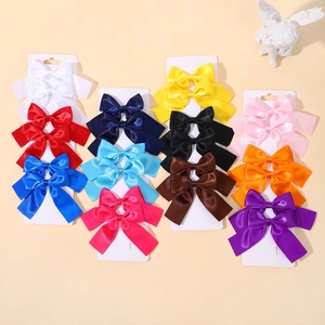 Colorful 11-piece satin bow hair clip set for girls on a decorative display card