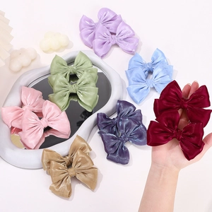 Set de pinzas para el pelo con lazos de satén en varios colores para niñas
