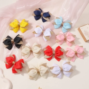 Set of 12 glitter handmade bow hair clips for girls in various vibrant colors