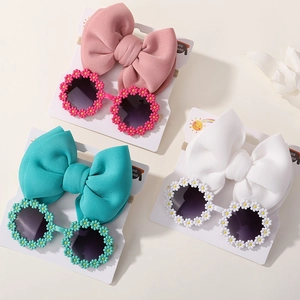 Kids daisy sunglasses and bow headband sets in pink, teal, and white colors