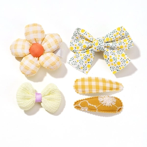 5-piece yellow floral baby girl hair clip set with fabric bows and flower patterns