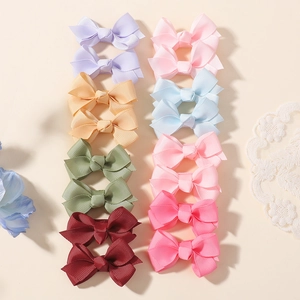 Lot de 12 barrettes nœuds papillon en ruban gros-grain coloris pastel pour filles