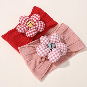 Detail of baby headbands with soft rib knit texture and red white checkered fabric flowers