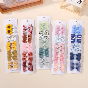 Detail showing colorful macaron hair clips with lace and crochet floral patterns