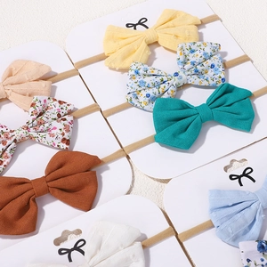 Détails des bandeaux pour bébé en coton et lin avec des bandes élastiques en nylon doux