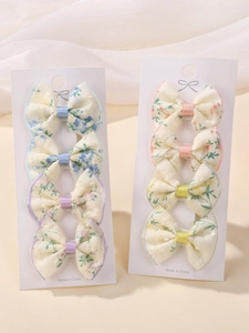 Detail of floral lace bow hair clips set on display cards for girls accessories
