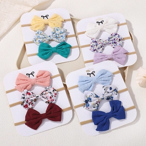 Lot de 12 bandeaux à nœuds pour bébé aux couleurs variées et motifs floraux