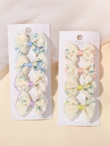 Detail of 8pcs beige lace floral bow hair clips set on white display cards for girls