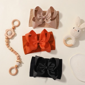 Three-piece baby jacquard bow headband set in beige, orange and black colors