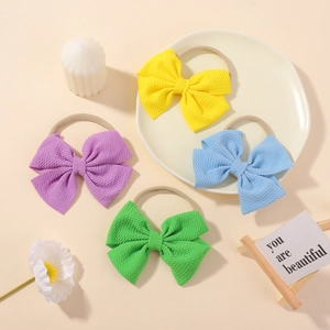 Set of 4 soft waffle fabric bow headbands with elastic nylon bands for baby girls