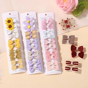 Handmade cute girls hair clips set with floral, plaid, and polka dot patterns for kids